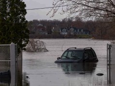 A submerged car by floodwaters